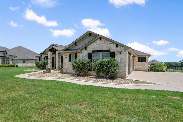 view of front of home with a garage and a front lawn