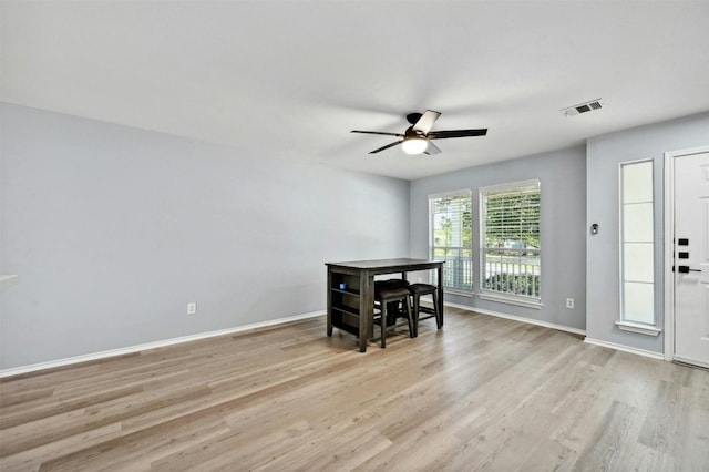 dining room featuring light hardwood / wood-style flooring and ceiling fan