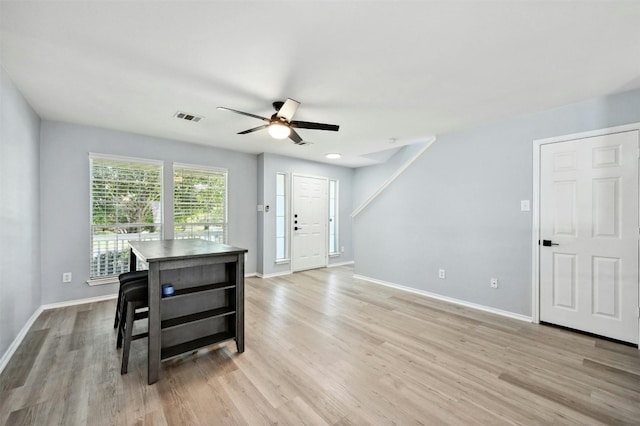 dining area featuring ceiling fan and light hardwood / wood-style flooring