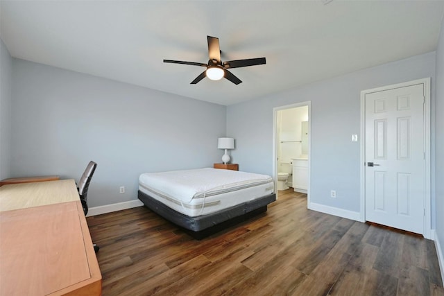 bedroom with dark hardwood / wood-style floors, connected bathroom, and ceiling fan