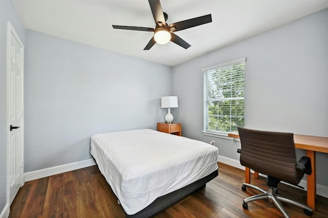 bedroom featuring dark hardwood / wood-style floors and ceiling fan