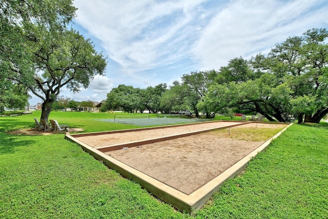 view of property's community featuring a yard