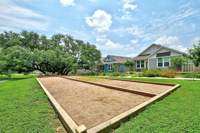 view of property's community with a lawn