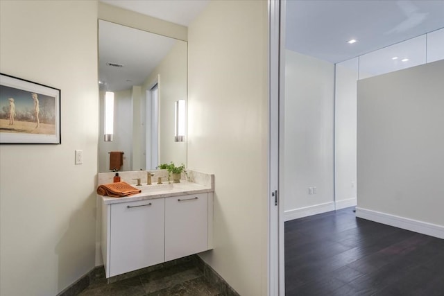 bathroom with wood-type flooring and vanity