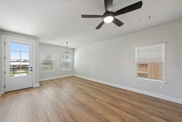 unfurnished room featuring ceiling fan and light hardwood / wood-style floors