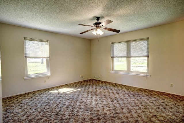 empty room featuring carpet, a textured ceiling, and ceiling fan