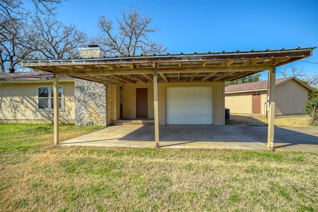 exterior space featuring a yard and a garage