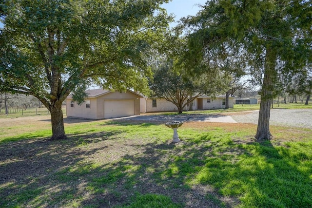 view of front of property featuring a garage and a front yard