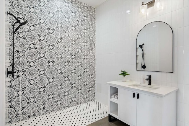 bathroom with vanity and tile walls