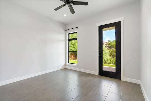 interior space with ceiling fan