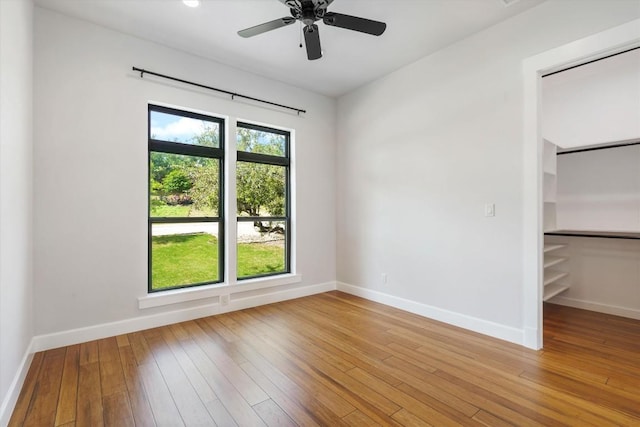 empty room featuring light hardwood / wood-style floors and ceiling fan