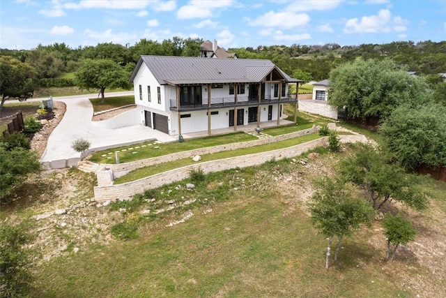 back of house featuring a garage