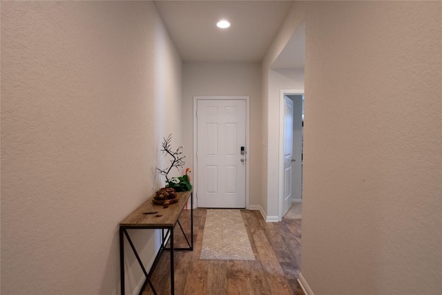 doorway with hardwood / wood-style floors