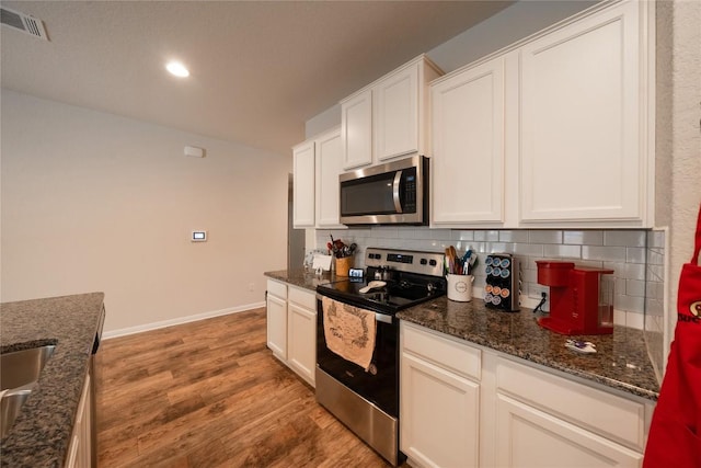 kitchen featuring white cabinetry and appliances with stainless steel finishes