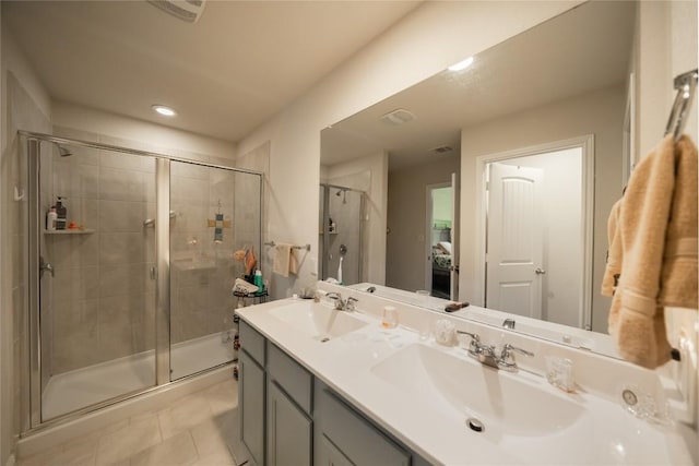 bathroom with vanity, tile patterned floors, and walk in shower