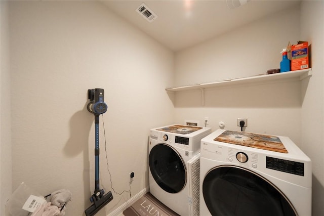 laundry room with separate washer and dryer