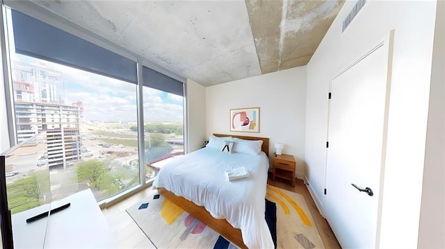 bedroom featuring floor to ceiling windows