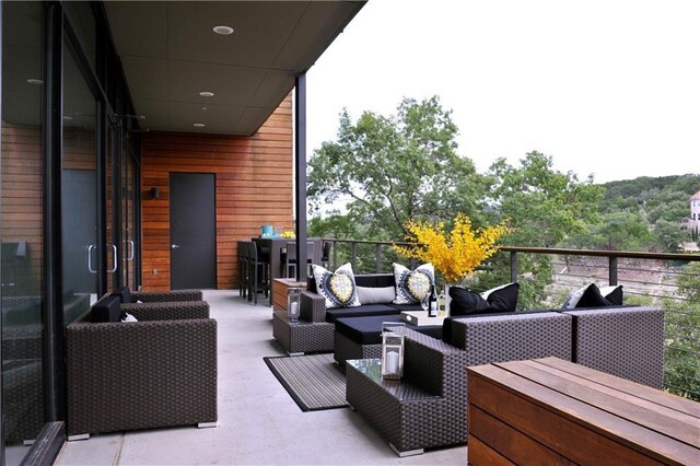 wooden terrace featuring outdoor lounge area