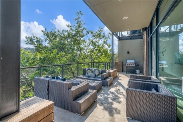 balcony with area for grilling and outdoor lounge area