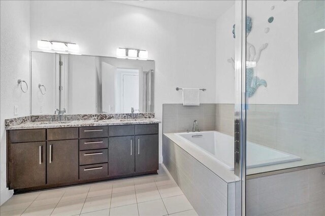 bathroom with vanity, tile patterned floors, and independent shower and bath