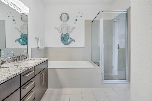 bathroom with tile patterned flooring, plus walk in shower, and vanity