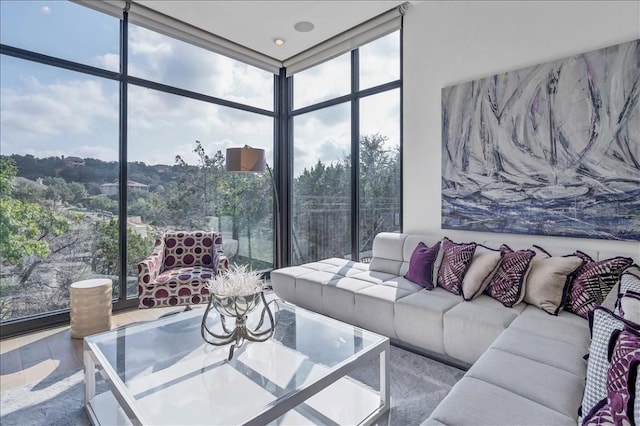 living room with hardwood / wood-style floors and expansive windows