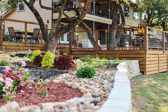 back of property with a wooden deck