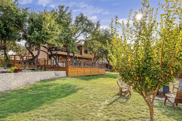 3709 Alamo Cv, Lago Vista, TX 78645 - view of grassy yard featuring a wooden deck