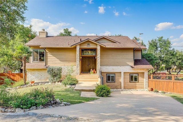3709 Alamo Cv, Lago Vista, TX 78645 - view of front of home featuring a chimney and stone siding
