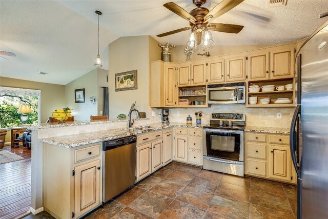 3709 Alamo Cv, Lago Vista, TX 78645 - kitchen featuring stainless steel appliances, lofted ceiling, ceiling fan, open shelves, and a peninsula
