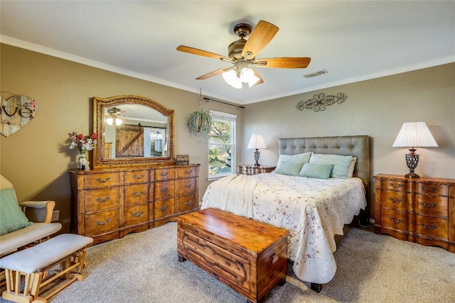 bedroom with crown molding, ceiling fan, and carpet flooring