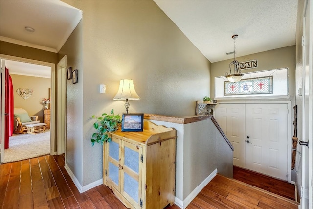 entrance foyer featuring lofted ceiling and hardwood / wood-style floors