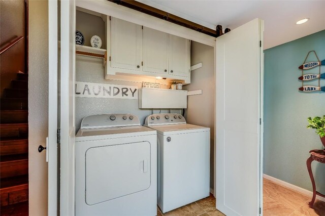 3709 Alamo Cv, Lago Vista, TX 78645 - laundry room with separate washer and dryer, cabinet space, and baseboards
