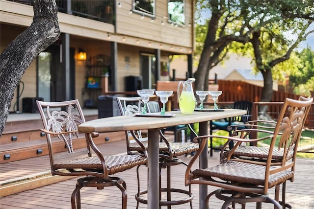 3709 Alamo Cv, Lago Vista, TX 78645 - wooden deck with outdoor dining area