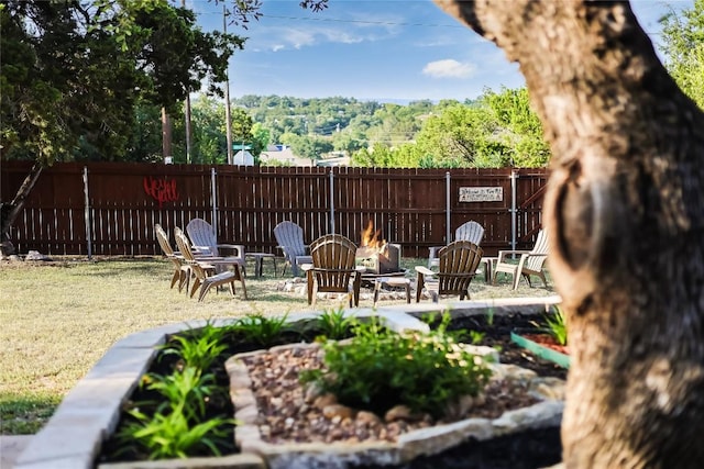 view of patio / terrace featuring an outdoor fire pit