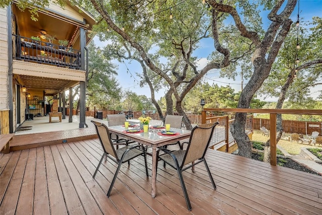 3709 Alamo Cv, Lago Vista, TX 78645 - wooden deck with outdoor dining space and a fenced backyard