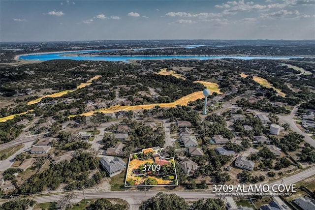 3709 Alamo Cv, Lago Vista, TX 78645 - aerial view of residential area with a large body of water and property boundaries highlighted