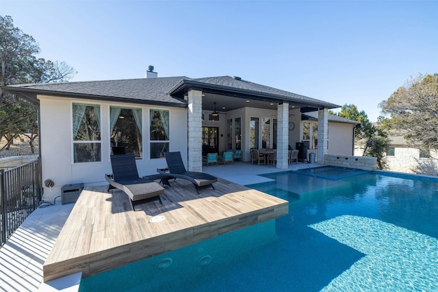 back of house with ceiling fan