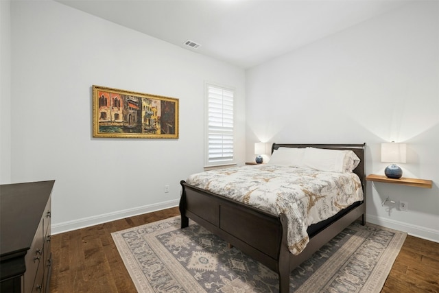 bedroom featuring dark hardwood / wood-style flooring