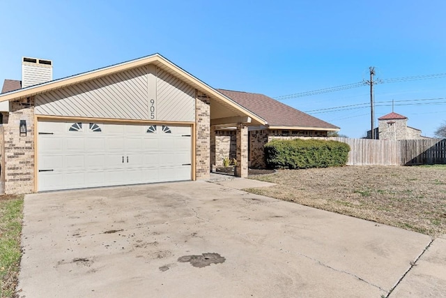 view of front of home featuring a garage and central AC unit