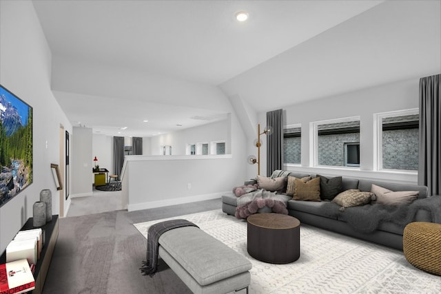 carpeted living area featuring lofted ceiling, recessed lighting, and baseboards