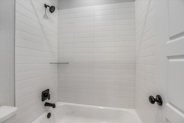 full bath with shower / tub combination and toilet