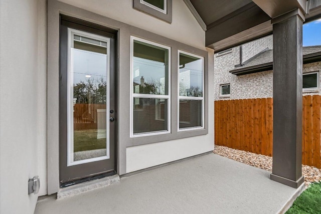 view of patio featuring fence