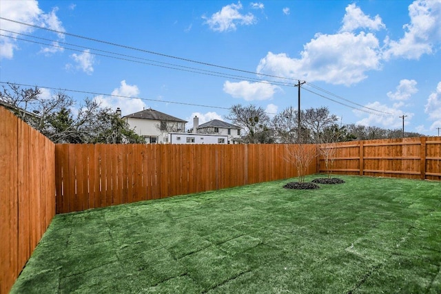 view of yard featuring a fenced backyard