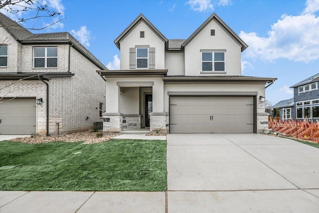 view of front facade featuring a garage, stone siding, concrete driveway, and stucco siding