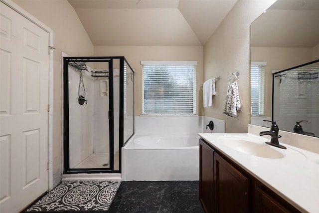 bathroom featuring lofted ceiling, vanity, and independent shower and bath