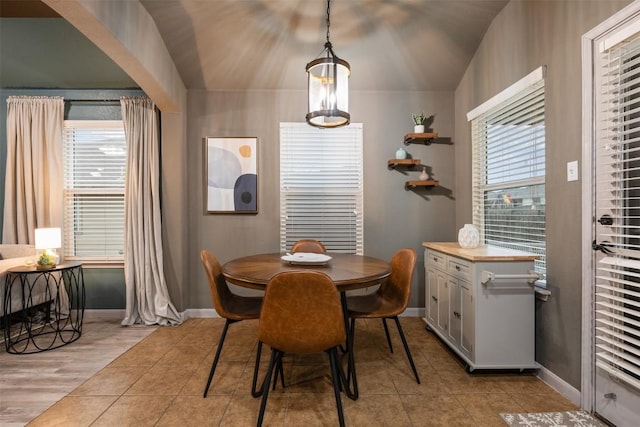 tiled dining area with a healthy amount of sunlight