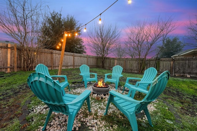 patio terrace at dusk with an outdoor fire pit