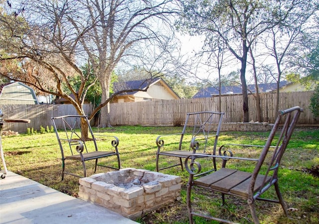 view of yard featuring a patio and a fire pit