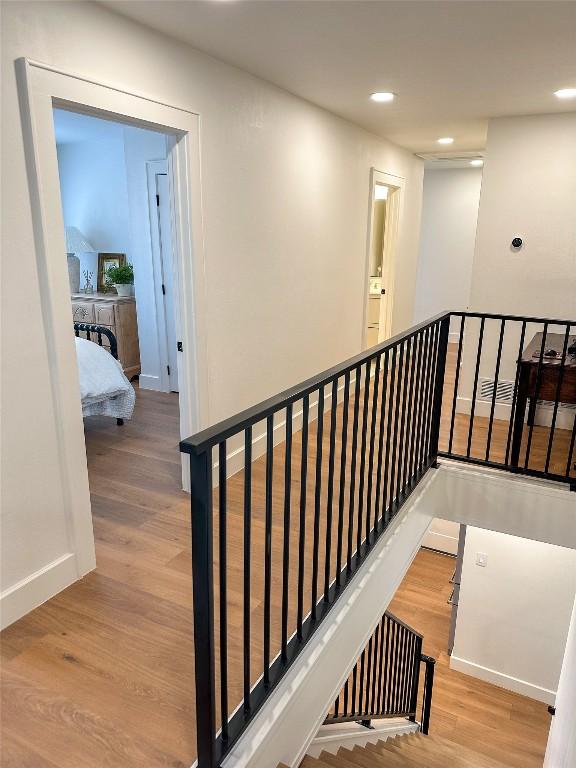 stairway featuring hardwood / wood-style floors